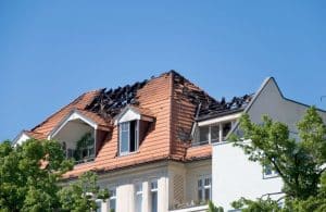 A fire-damaged house is being repaired to sell.