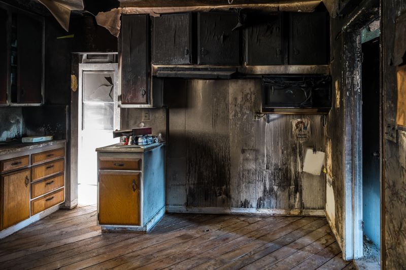 A fire-damaged house is being repaired to sell.